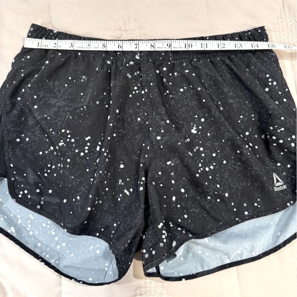 Reebok athletic shorts, med, EUC. Black with white paint splatter print.​